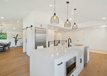 turned on pendant lamps above kitchen island