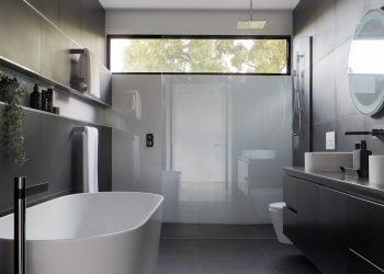 white ceramic bathtub near white bathtub