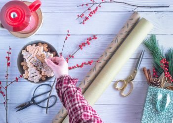 person holding brown wooden rolling pin